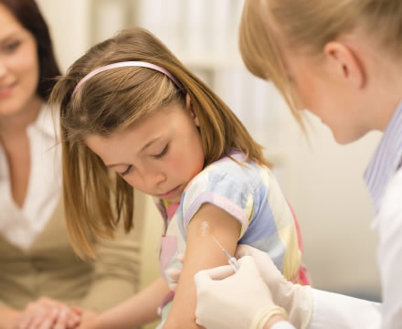 Girl receiving a vaccine shot